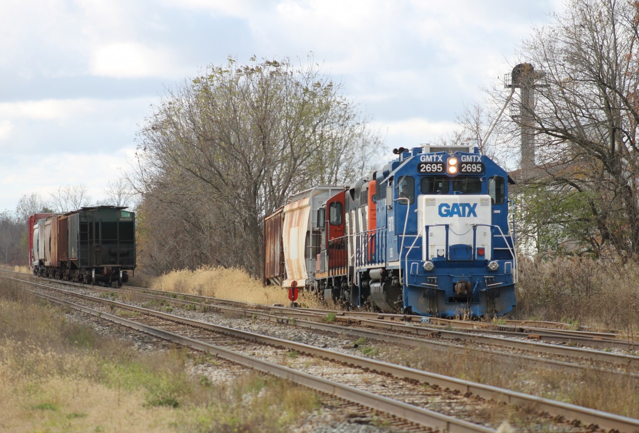 CN 514 is seen backing up into Agris with some cars.