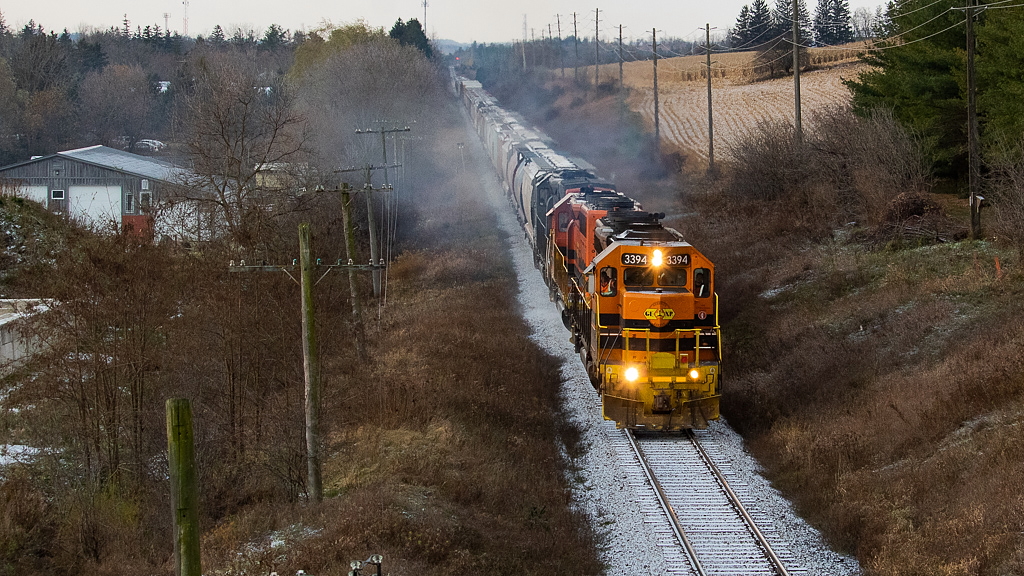It was a frigid morning with a light dusting of snow, in what is likely going to be my only time shooting 432. Here, 3394, 3403, and 3054 are about to pass under Jones Baseline as they continue the eastward march on the Guelph Sub.