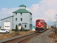 CP 235 rockets past the old mill/elevator in Elmstead, Ontario. The building was repurposed a few years ago and is now used as office space. For a comparison, please check out Geoff Elliott's shot of the Expressway here in 2000. http://www.railpictures.ca/?attachment_id=33837