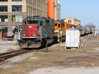 On the eve of the transition of the Guelph Subdivision from the Goderich-Exeter Railway (GEXR) to CN, Ontario railway history will refresh just as it did 20 years prior. On that November night, GEXR was poised to take over operations on the line and related spurs with a fleet of their own four-axle units as well as borrowed CN power.  The shortline had built upon what CN had left them, created a bigger customer base and grew traffic on these lines, even as the world around the railway continued to change. In recent years, implementation of GO Trains and a new CTC system were the latest additions to the Guelph Subdivision with no doubt more upgrades with proposed increased passenger traffic to follow in the coming years.  Two decades later, GEXR and their crews officially completed what they had set-out to achieve on the lines they had acquired, which was quite simply to haul the freight. From RailTex to RailAmerica and eventually to Genesee & Wyoming they did just that. Red painted locomotives became silver and then finally orange with literally every color in between. 

Here we see GEXR train 431 departing Kitchener heading over King Street, which is a crossing that no long exists with a tunnel motor that once belonged to a railroad that now only continues to survive in history books. On any other day, a former SP SD45 leading a train might seem out of place, however on GEXR it became the norm. Just as 3054 headed to Stratford on that day….so does GEXR.  It’s far from a retreat, but rather a new beginning, the next chapter for the railway as it looks back on the last 20 years and welcomes a future that has yet to be written. 



