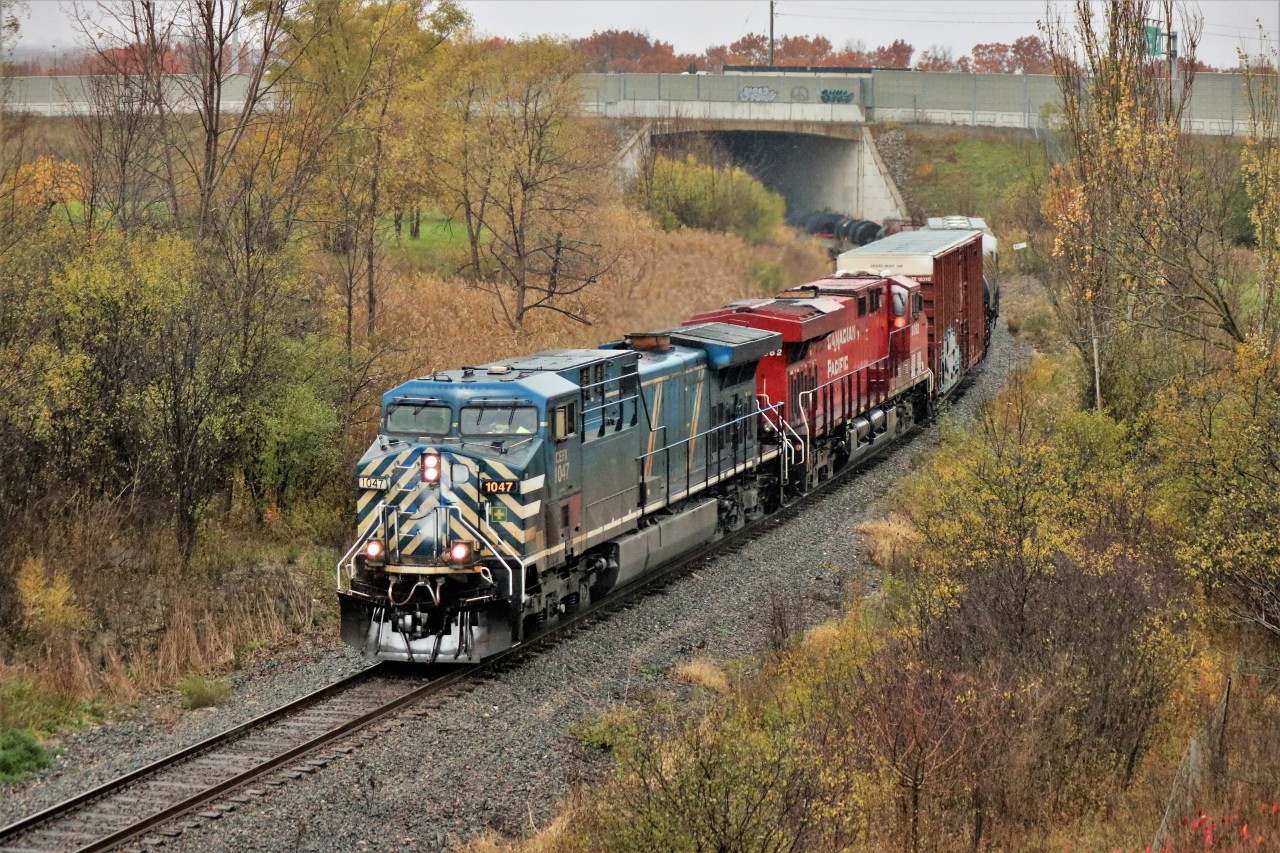 On top of the escarpment it is snowing and CEFX 1047 is showing some on the nose, but down in the Hamilton basin it is pouring rain. The daily CP 246, running rather early, slowly makes its way down the hill on its way to Kinnear Yard.