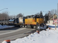 Remembering the GEXR: Here is a shot back in February 2015 with no G&W orange and yellow in the power. A daylight run on a nice sunny day of GEXR 584 (I think was the train symbol) crosses Weber Street, very close to its termination of Kitchener yard. The LRT construction was in its very early stages, and the original railway crossing warning 'X' was still in place. I still don't understand why some crossings (like this one) over spur lines just get this sign and no signals for crossing protection, where other less busy roads get signals. Weber St. is a main road that runs north-south through Kitchener-Waterloo. Nonetheless, this is all history now. The power is LLPX 2210-RLK 4001.