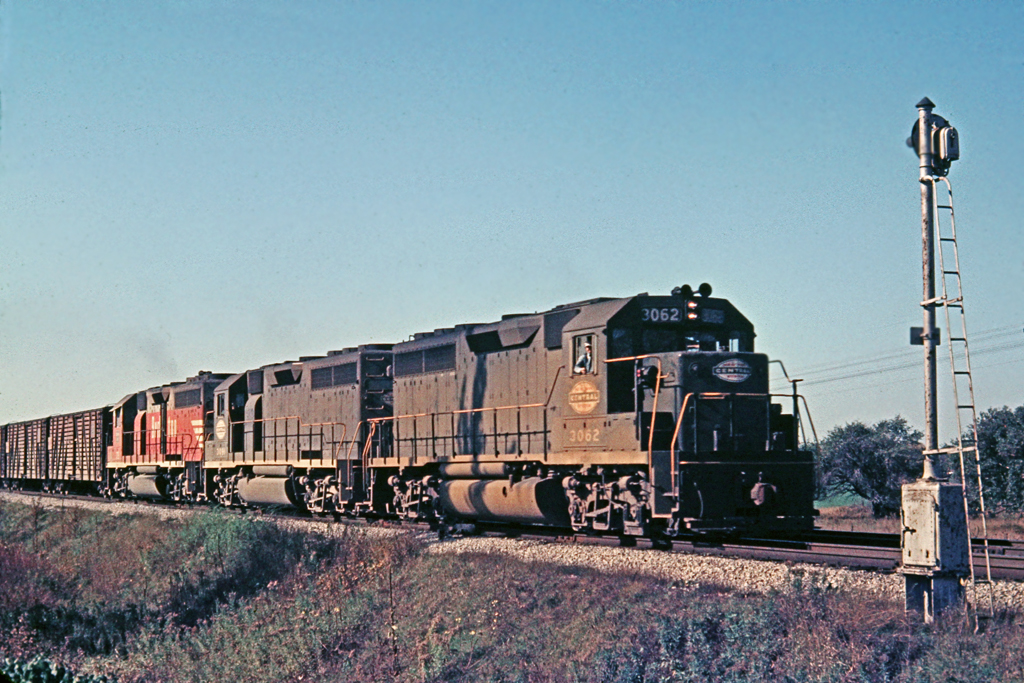 A pair of NYC GP-40's 3062-3091 and a CB&Q GP-40 are on NY4 near Clanbrassil, ON.  The stock cars on the head end are the identifying feature for NY4.  Geolocation coordinates are in the area of the photograph.