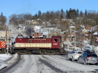 Ahh... I long for those cold, crisp, but 'kodachrome sky' days in winter where the sun's out and you get much more sun than you do in November. This is where the station was once located, just to the left, and Guelph's 'east of downtown' hood is in the background. OSR 505 is giving a little puff of smoke, traffic sufficiently stopped the crew is getting back up to speed. I thoroughly enjoy these little guys, who make frequent apperances in Guelph, sometimes in pairs or trios if you are lucky.