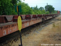 I rarely do going away shots of trains, but this one spoke to me. Rust coloured everything, appropriate for the service this train is in, showing details of these steel train cars perfect for the modeller types. CN 4725's headlight is easily seen through the empty cars approaching Victoria Ave in ever gritty Hamilton.