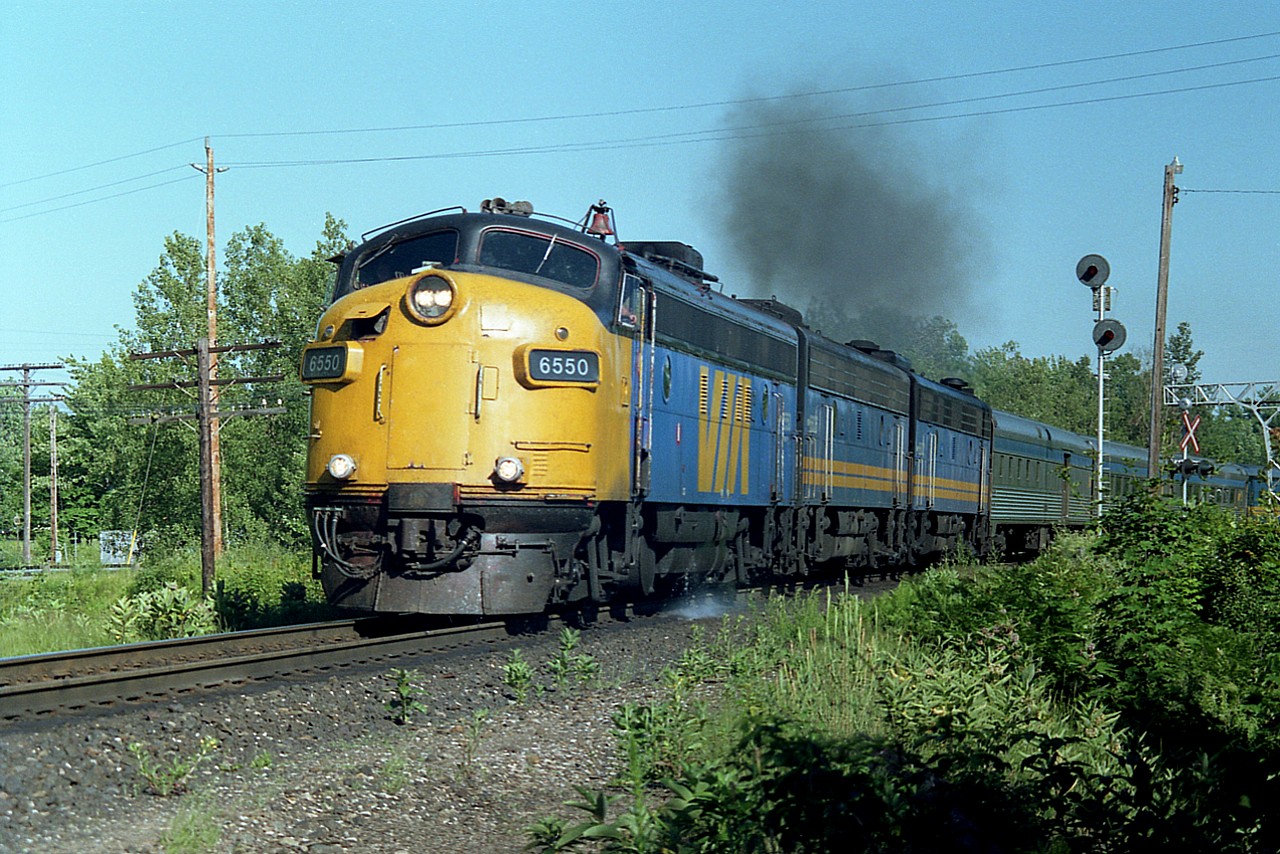 Back in the '80s Parry Sound was a great place to see trains. Especially the Canadian, as it was a daylight run back then. Here is the northbound, just accelerating out of the CN Parry Sound station, I am standing on the north side of the Isabella St crossing for this shot, using an old Pentax K-1000 which was probably the best 35MM clunker I ever owned. And this old image looks like it could have been shot yesterday (it is a neg, not a slide!) ; VIA 6550, 6636 and 6632. The FP7A leader was once CP 1400, (there is still 'red' on the bell and around the window frame)and it made the rounds over the years and is back to being CP 1400 once again!!! Upgraded to an FP9...in Script !!!
