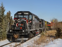 New arrivals to Cando's switching operation of the West Fraser pulp mill in Hinton, AB arrived a week or so before this photo was taken to replace two former IAIS SD38-2s leased from CIT. CCGX SD40-2 5305 (ex CP 5847) and CCGX SD38AC 5202 (ex DMIR 200) will now be the new power. Third unit, CEFX SD38-2 6057 was along for the ride on this day as Cando was trying to empty the fuel tank before handing the unit over.