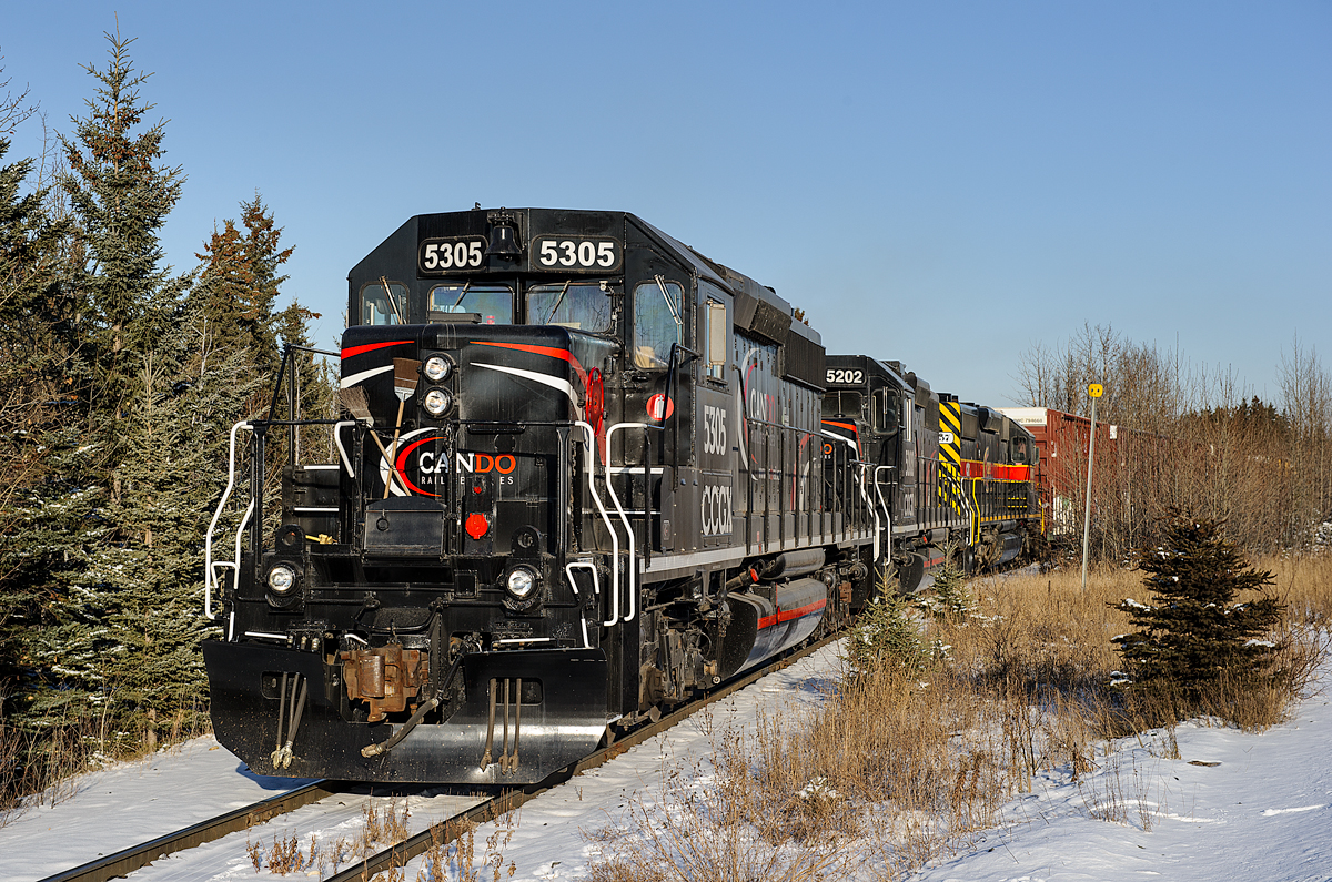 New arrivals to Cando's switching operation of the West Fraser pulp mill in Hinton, AB arrived a week or so before this photo was taken to replace two former IAIS SD38-2s leased from CIT. CCGX SD40-2 5305 (ex CP 5847) and CCGX SD38AC 5202 (ex DMIR 200) will now be the new power. Third unit, CEFX SD38-2 6057 was along for the ride on this day as Cando was trying to empty the fuel tank before handing the unit over.