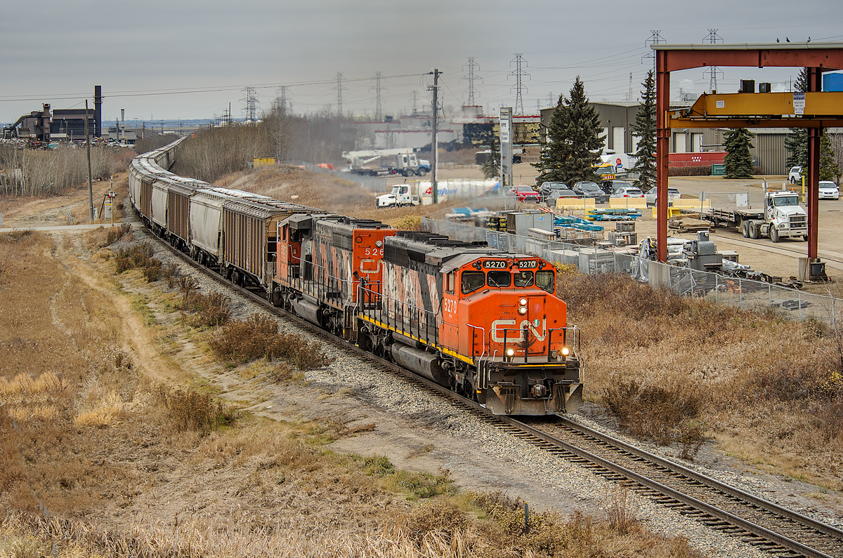 L518's engineer sticks it in the corner as his tailend has just cleared the East Edmonton siding. Man, did this pair of SD40-2Ws sound great gathering speed in Notch 8 with 95 grain empties on the drawbar.