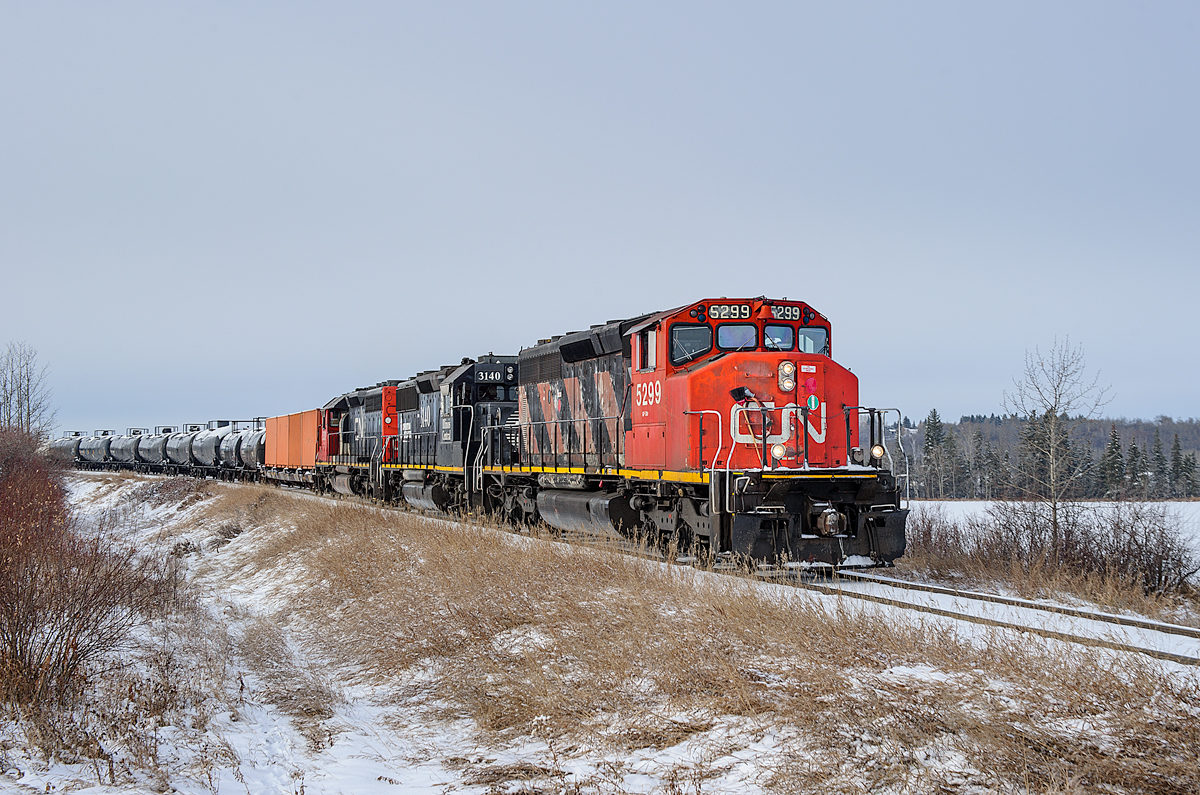 Fort McMurray bound CN train L557 is back on the move again after making a setout for On-Track at Daugh.