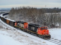 CN SD40-2Ws 5325 and 5279 grind to a halt with L516's train of 74 gravel loads just west of the Edmonton Intermodal Terminal waiting for permission from CN's Walker Control yard master to enter the city of Edmonton.