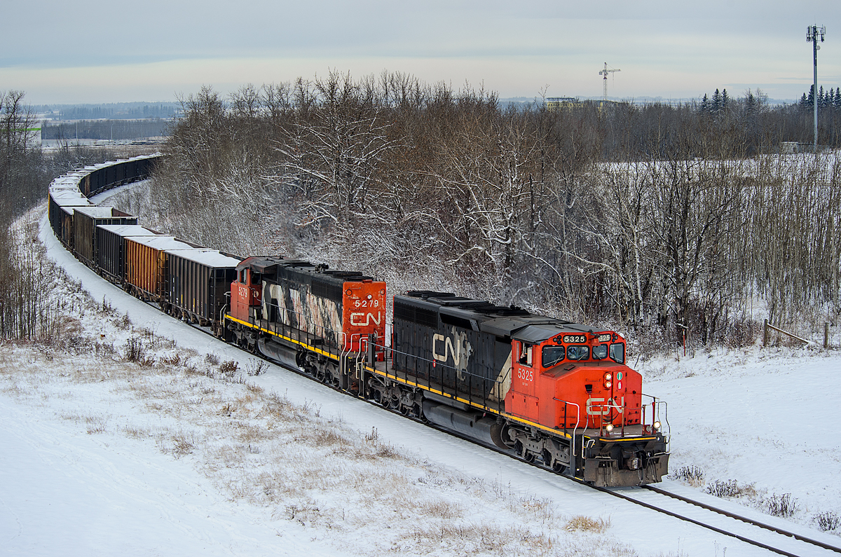 CN SD40-2Ws 5325 and 5279 grind to a halt with L516's train of 74 gravel loads just west of the Edmonton Intermodal Terminal waiting for permission from CN's Walker Control yard master to enter the city of Edmonton.