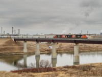 CN SD40-2Ws 5349, 5277 and 5264 lead 104 loaded plastic/chemical cars across the North Saskatchewan River enroute to CN's Walker Yard in Edmonton.