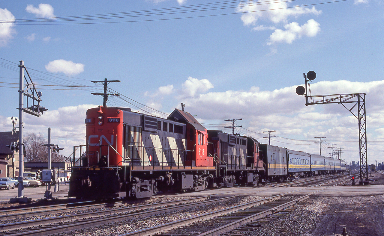 CN 3118 leads a VIA train through London, Ontario on March 25, 1981.