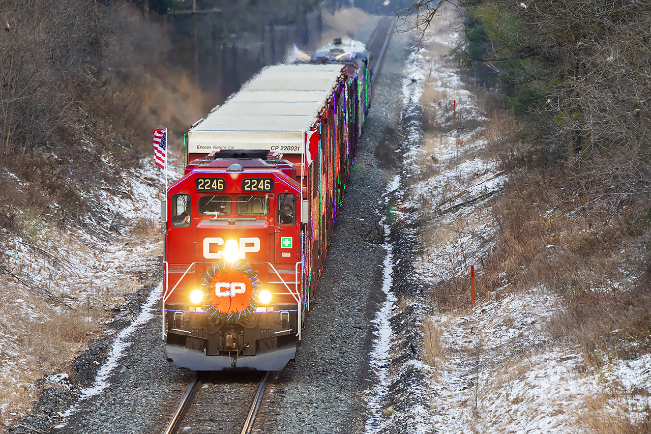 Giant "Extra" flags fly as the Christmas train approaches Galt.