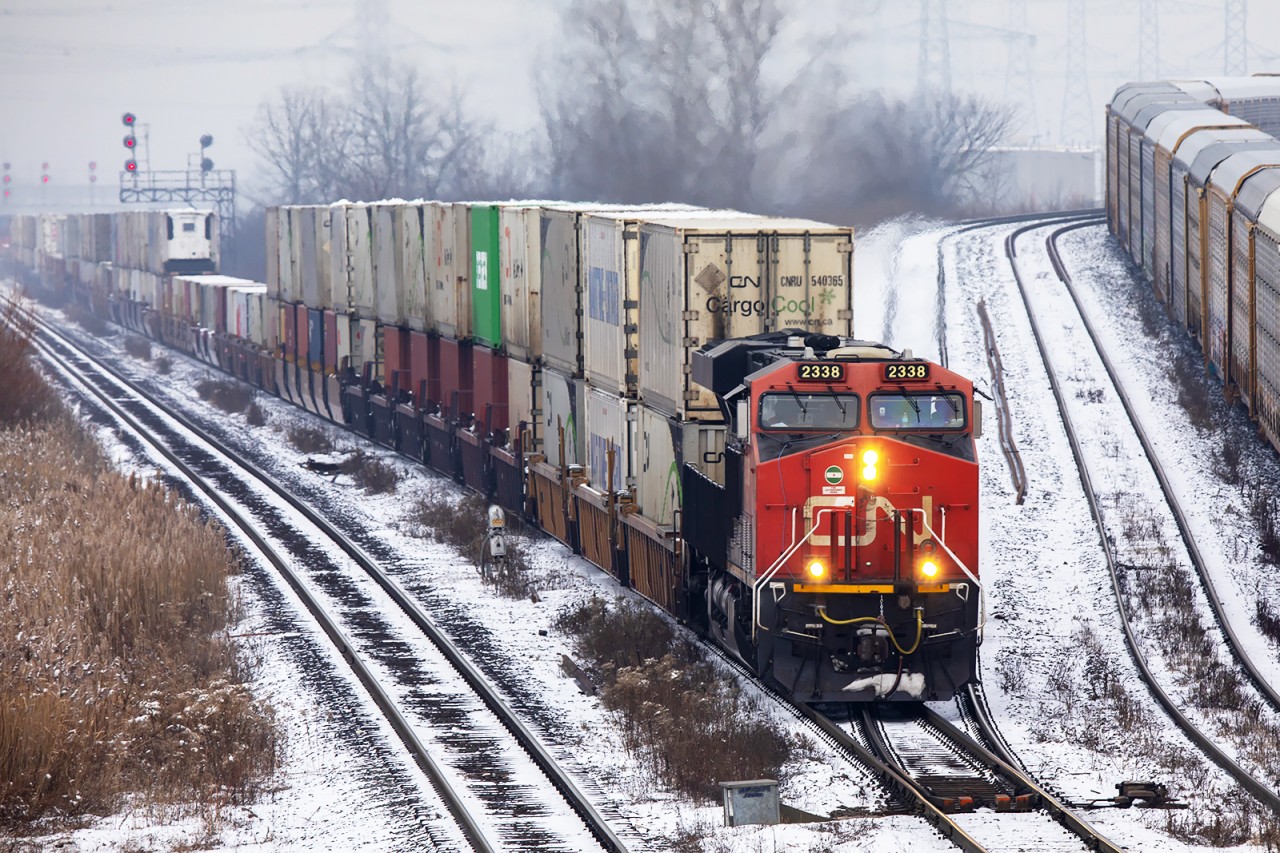 Charging through the connecting track between the Halton and York Subs, 2338, mid train SD70 8886 and 2330 trailing take another "Landbridge" east, and then likely north west.