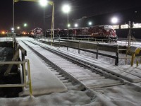 A Fresh snowfall helps to brighten this scene of stored AC4400's and GP38'S by the turntable. All the units are now back in service.