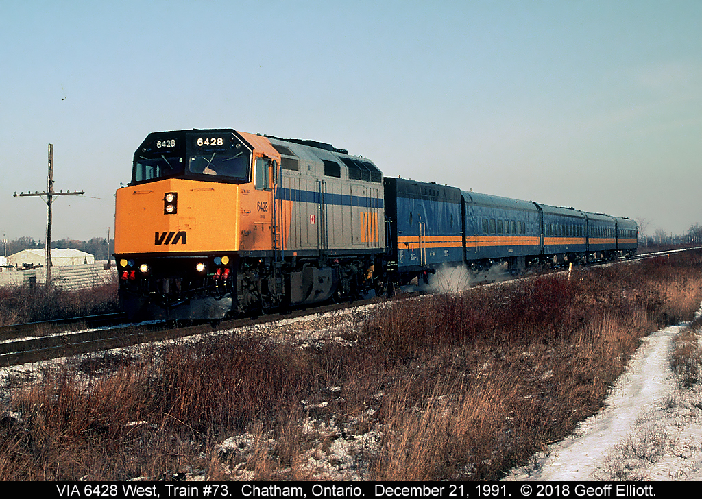 Unlike 2018, on December 21, 1991 it was cold and there was plenty of snow!!!   With the steam generator helping keep the passengers warm on this cold day, VIA 6428 leads the way as it approaches the Sass Sideroad just east of Chatham, Ontario.