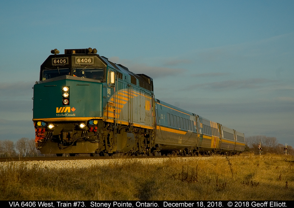VIA F40PH-3 #6406 leads a 10 minute late Train #73 through Stoney Pointe, Ontario an into some low start of Winter sunlight.  Even the green units look good when the light hits them right.