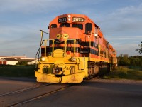 The late evening hours on the night of the Summer Solstice in North Waterloo find GEXR 584 creeping slowly north on the Waterloo Spur towards Elmira with three tank cars. They are passing by the St Jacobs Market and right behind me on the east side of the tracks lies the Max’s Sports World facilitate where Waterloo Central hopes to add a new stop for their tourist train in 2019! <br> 
Glad I got this shot! As of this posting (December 2018), the Waterloo Region is said to have resonantly acquired all 14 LRVs for it’s LRT system and now the LRT is entering its serious stages of testing as the region hopes to have it open and ready for service in Spring 2019. Due to the fact that 3 miles of the Light Rail Transit route is shared with the Waterloo Spur, all freight traffic on the Waterloo Spur is now permanently restricted to run northbound between 23:00 and 24:00 and southbound between 03:00 and 04:00 due to the intensity of the Light Rail service during the day. With that, the chances of ever catching a freight on the Waterloo Spur in any type of daylight are now next to impossible. Time was 20:45