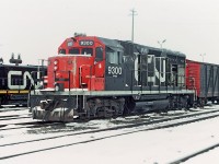 CN 9300 at the Calder diesel shop in Edmonton, Alberta. I believe this is one of two GP35's that CN had and was originally numbered 4000. Anyhow, on this winter afternoon I had done a quick sweep through the shop area on the way to work and found this unit there. It was dead and drained, whistle and exhaust stack taped and capped, bell missing and obviously not in service. Really don't know the disposition of the 9300 and why it was there. I can't recall if I took an image or two of the old wooden boxcar and tank behind the unit, never know what I might find in a dusty yellow slide box.