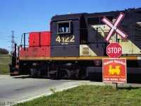 "The Little Engine that Could": CN GP9RM 4122 operates on the local wayfreight working on the Dupont Spur in Kingston, passing a quaint sign erected at one of its crossings. The name of the Dupont Spur was later changed to the Cataraqui Spur when Dupont sold the Kingston plant to Invista.<br><br>Another view along the Cataraqui/Dupont Spur: <a href=http://www.railpictures.ca/?attachment_id=33907><b>http://www.railpictures.ca/?attachment_id=33907</b></a>