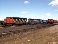 In this view, a detouring CN freight on CP at Smiths Falls is pictured pulling out of the station past a nearby CP freight at the station, with CN SD40-2W 5335 leading leased Conrail C40-8W units 747, 752 and 748. For a photo of the trailing units: <a href=http://www.railpictures.ca/?attachment_id=35537><b>http://www.railpictures.ca/?attachment_id=35537</b></a>.