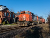 Déjà vu: Road-worn, but still earning their keep, a pair of 'Zebra Stripe' GP38-2Ws guide train L540 through Guelph, ON in a scene that likely hasn't played out since CN last operated on this line in the 1990s. Up until CN's takeover of the Guelph Subdivision on November 16th, 2018, this line was operated by the Goderich-Exeter Railway.