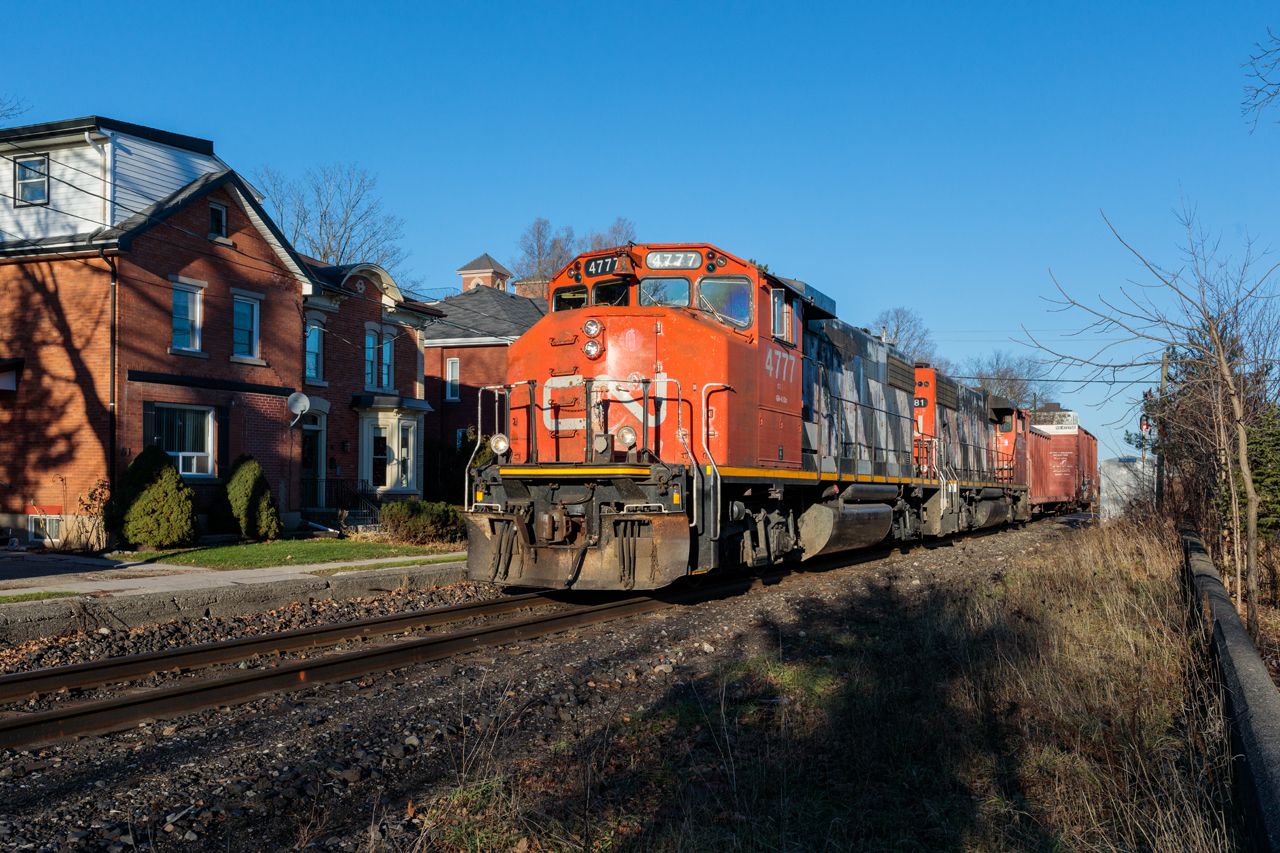 Déjà vu: Road-worn, but still earning their keep, a pair of 'Zebra Stripe' GP38-2Ws guide train L540 through Guelph, ON in a scene that likely hasn't played out since CN last operated on this line in the 1990s. Up until CN's takeover of the Guelph Subdivision on November 16th, 2018, this line was operated by the Goderich-Exeter Railway.