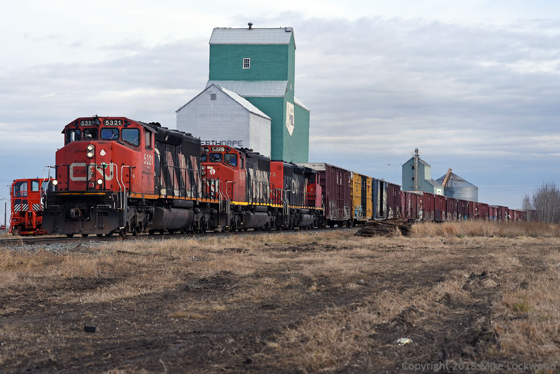 A trio of SD40-2W's (5321, 5279, 5325) pass a surviving grain elevator in Mayerthorpe, AB, working westbound with 515's train to Whitecourt. For me, it's hard to believe that such as shot is still possible in 2018. 1538hrs.
