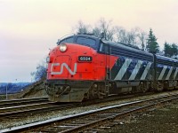 A overcast afternoon as a east bound passenger train drifts off the Dundas sub at Bayview Junction.