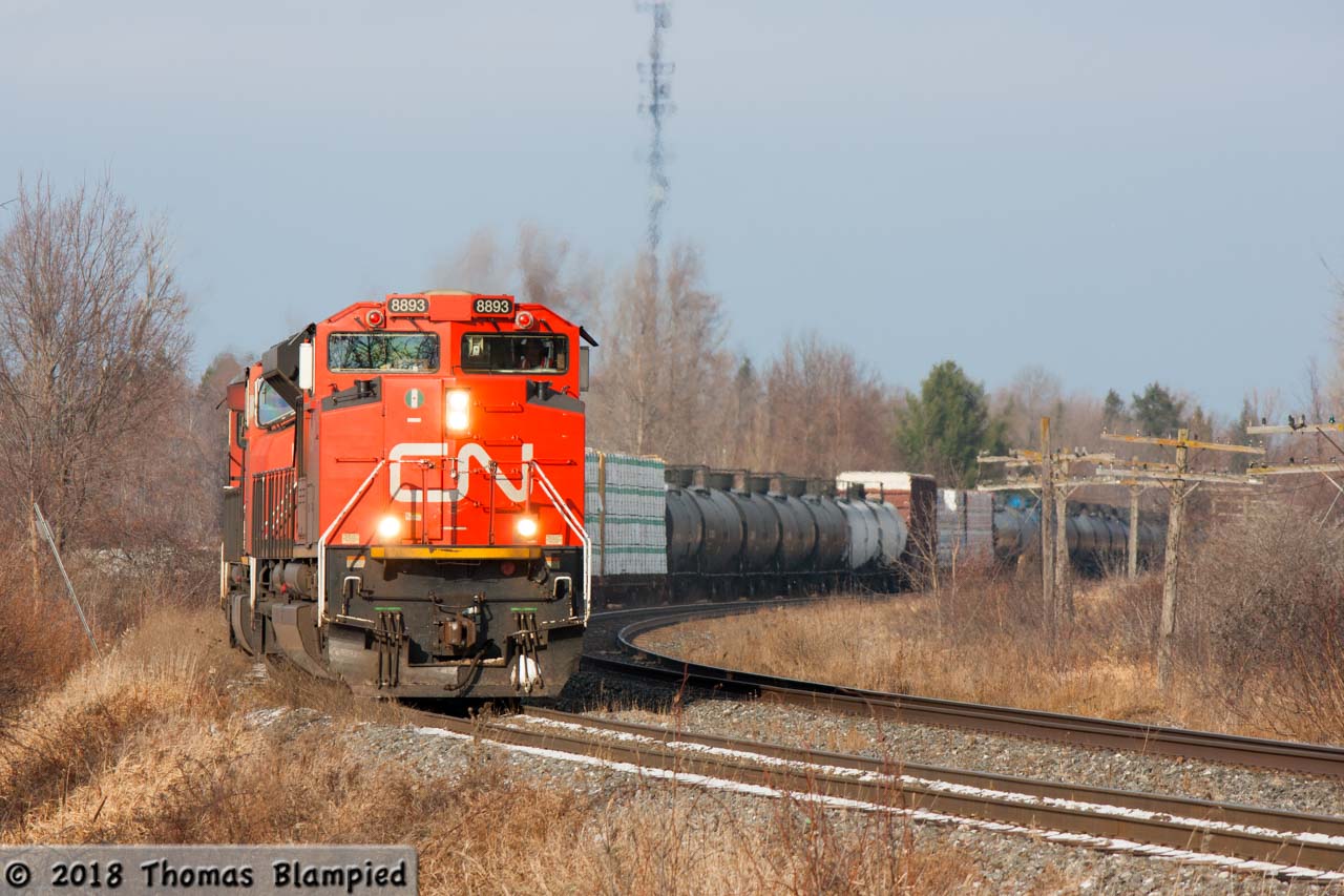 Southbound 318 crawls towards the Ramara Road 47 crossing, which splits the Brechin East siding in half. The train waited for a trio of northbounds to pass, a process that took over an hour.