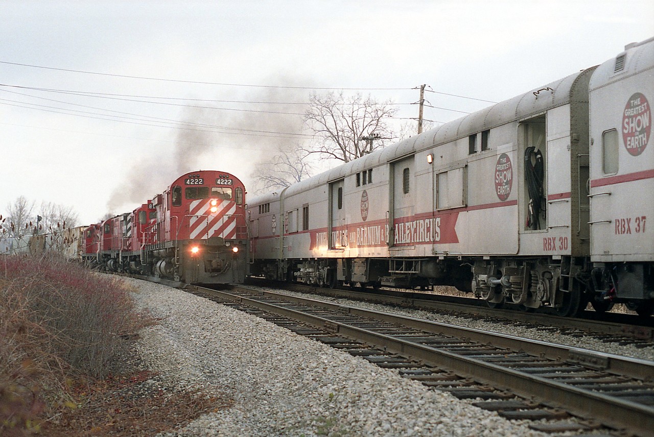 A follow-up to an image I posted recently of west/southward train in Niagara Falls........it is such a loss for the rail buffs to see the demise of almost everything to do with "Steel Wheels" in Niagara when scenes like this could be had not that long ago. Here is CP 4222, 8212, 4245 and 8208 passing the Circus Train, which also happened to be in town. Behind CP 8207, 8205 and 1684, the train had taken a 'time out' in order that the animals be exercised.