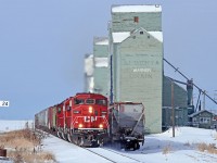 I was fortunate to have stumbled upon CP's A08 assignment to Coutts, AB / Sweetgrass, MT., and a connection with the BNSF, as I was myself headed to the border crossing this day. CP 6261, 6309, and 6251 lead the way past the surviving wheat kings at Warner. 1309hrs.