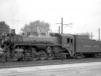 A closer view of CP P1b-class Mikado 5118 at Galt in October 1959. It's seen trailing SW1200RS 8146 that had assisted it on a westbound freight (seen <a href=http://www.railpictures.ca/?attachment_id=25862><b>here</b></a>). Note the overhead catenary in the background for the GRR's electric operations.