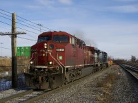 CP 143 with CP 8544 & CEFX 1059 for power slowly advances towards the Lachine Station platforms as it performs a lift at the nearby Lachine IMS Yard. Note the mismatched numberboards on the leader.