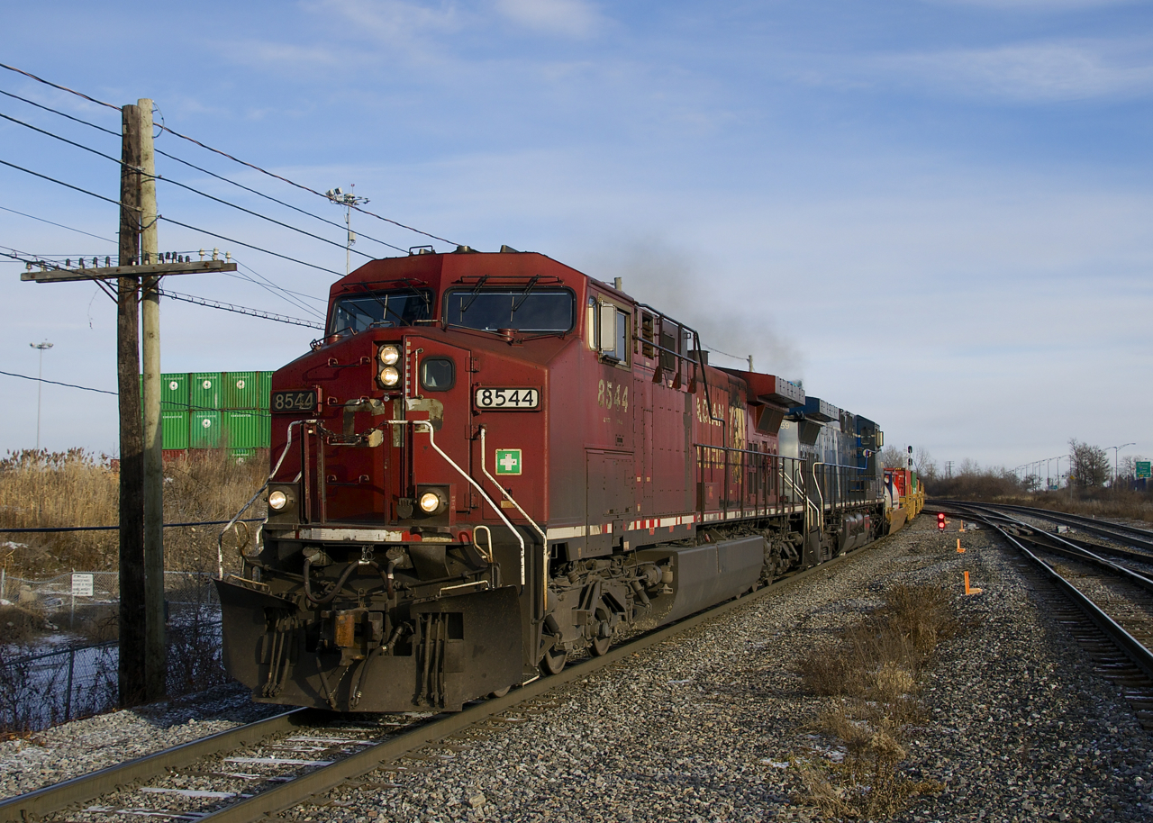 CP 143 with CP 8544 & CEFX 1059 for power slowly advances towards the Lachine Station platforms as it performs a lift at the nearby Lachine IMS Yard. Note the mismatched numberboards on the leader.