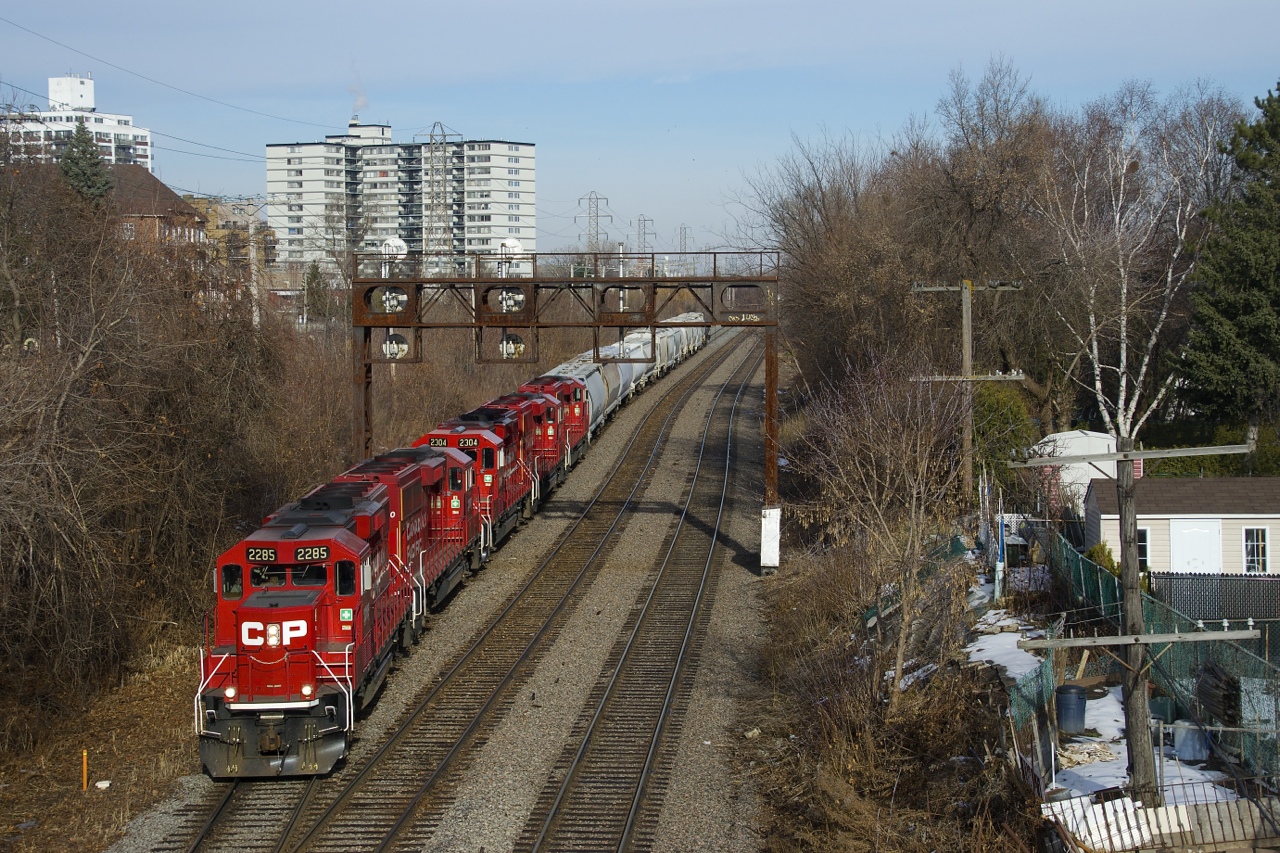 After some rain and some above freezing weather nearly all the snow is gone in Montreal, as CP F94 ducks under a vintage signal bridge with five GP20C-ECO's (CP 2285, CP 2280, CP 2304, CP 2262 & CP 2307) and a shorter than usual train.