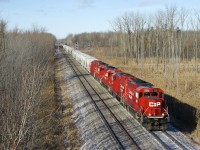 Five GP20C-ECO's (CP 2261, CP 2285, CP 2307, CP 2253 & CP 2257) lead CP F94 past Lavallée (named after CP employee and historian Omer Lavallée) and are about to duck under the Autoroute 730 overpass. The lead two units will be set off in 3 miles at Delson.