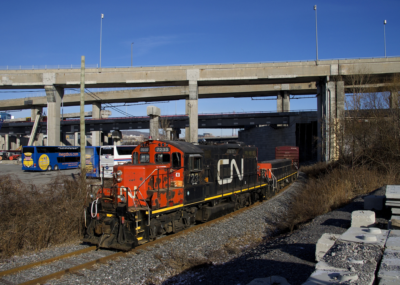 The Pointe St-Charles switcher has GP9 CN 7233 and slug CN 227 for power as it heads towards the Kruger plant with one boxcar in tow. The train is on the Turcot Holding Spur, which reopened around the start of the month after being closed since August, due to infrastructure and track work nearby.