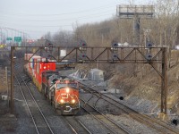 CN 120 with CN 2248, BCOL 4649 & CN 2587 up front is exiting Taschereau Yard. Mid-train is CN 8817.