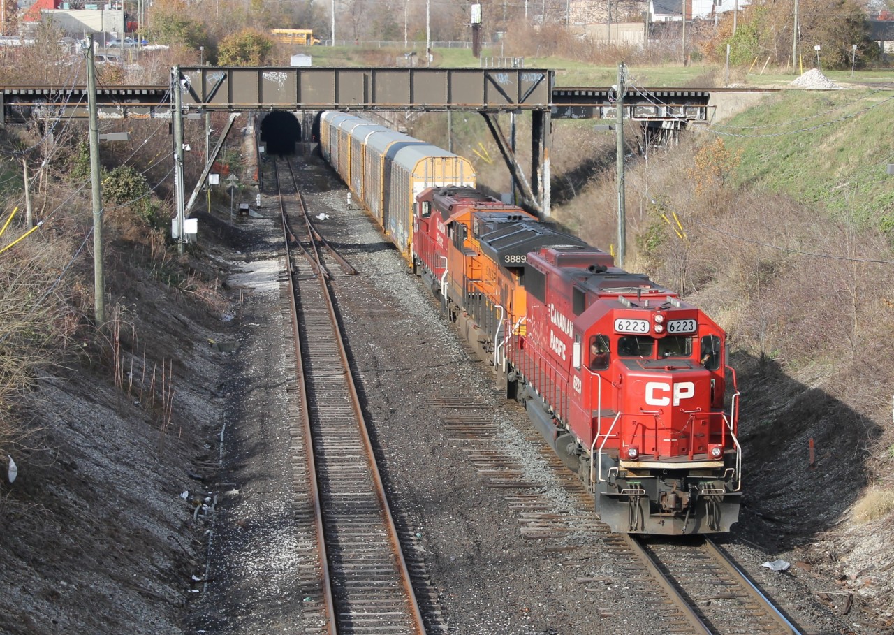 With a 15mph speed restriction, CP T28 comes back from Detroit with CP 6223, BNSF 3889 & CP 5023. It would meet CP 141 behind me.