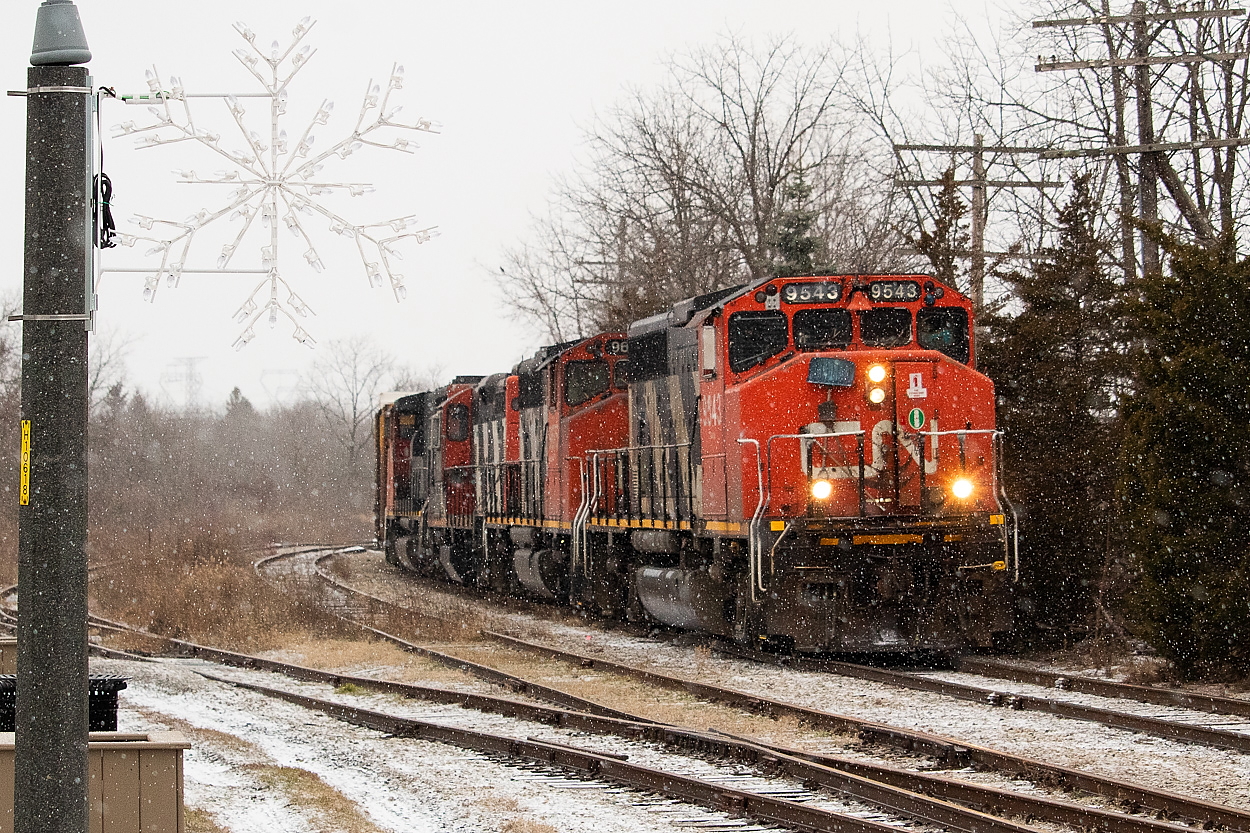 "It's beginning to look vaguely like Christmas." I was driving from Hamilton to Simcoe earlier today for family Christmas celebrations and turned the scanner on once I got a bit outside of the city in hopes of coming across 580 somewhere along the way. When I got closer to Caledonia I started to pick up some chatter and sure enough, I soon found them switching Nicholson & Cates in what was a first-time catch for me. The Town's holiday decorations on the lamp post worked well with the light dusting of snow that was falling at the time.