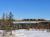 CN Q120 crosses over the trestle at East Mines, Nova Scotia. They will meet westbound train 407 at the siding at Belmont, about 8 miles from here, just west of Truro, Nova Scotia. 