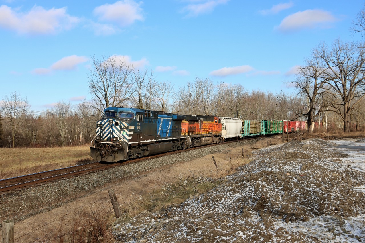 Finally a bit of sun for the area but boy it was cold waiting for this guy. CP 244 had a knuckle failure in Milton blocking both tracks for over an hour as a stood patiently freezing but finally CEFX 1040 with BNSF 5209 made their way westward on their way to London.