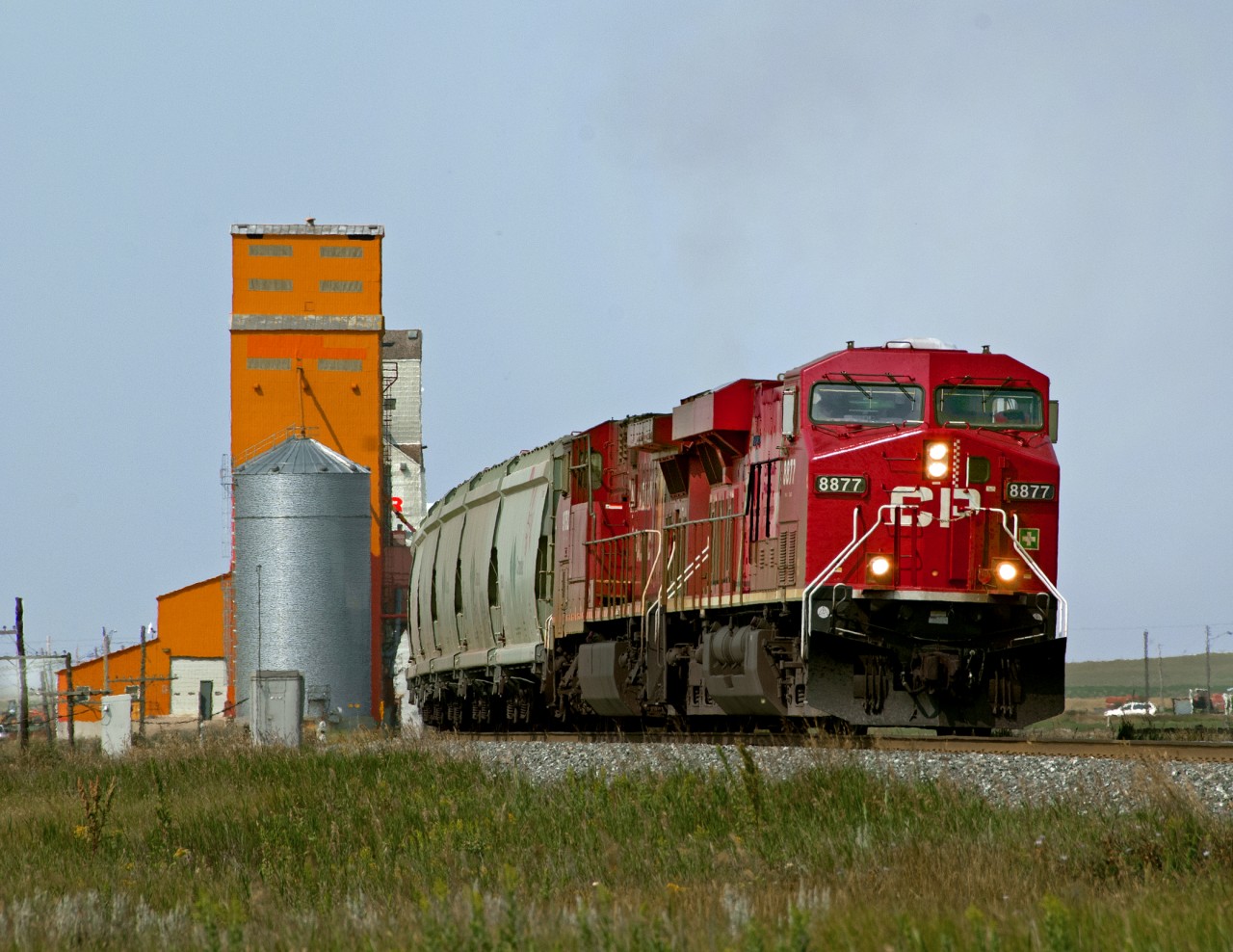 Potash Empties 672 pass the wooden grain elevators at Morse on the run between Swift Current and Moose Jaw
