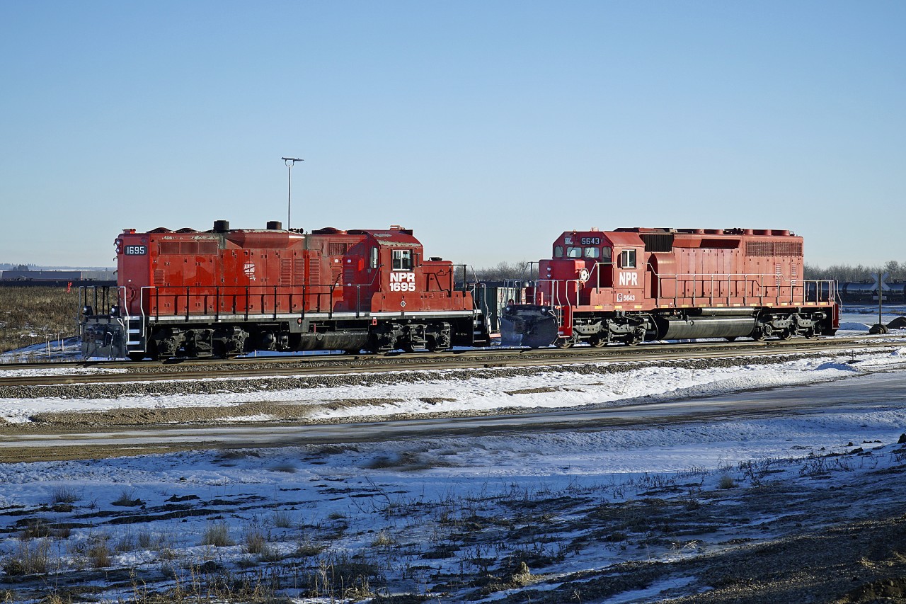 GP9u NPR 1695 and SD40-2 NPR 5643, both ex CP locomotives are seen at the Alberta Midland Railway Terminal in Lamont County.