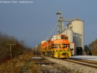 I had no plans to really spend my time following GEXR in the last weeks, with ample warning to 'get my shots' I had done so in the couple years leading up to the end, but then I started doing video in the waning days. It was sunny on Saturday November 11 when I woke up and I thought to myself, I may as well do a video at Mosborough.. and get back home in time to wake my girls for Pancakes. I enjoy trains at track speed and GEXR always put on a good show. I got out the door around 0800, went to Mosborough and noted the rails still covered in a light dusting of snow, block signals dark, zilch on the radio - usually the RTC gives 432 a work clearance to switch Kitchener or calls the RTC to denote they are done and heading east. I thought, I may as well go to Kitchener, maybe they are late. Upon arrival at Kitchener - radio silence, no train, rails snow covered, CTC dark for the mainline. That's odd, I suppose I'll just keep going - <a href=https://upload.wikimedia.org/wikipedia/en/d/d3/Breakfastwait.jpg target=_blank>Breakfast can wait. </a> What do I have to lose? Not like I'll have the opportunity to do this again.. Petersburg, Baden, New Hamburg.. nothing.. a friend mentioned they should still be in Stratford, ok, this is getting odd, it's nearly 0900 and the train should have been by Guelph by now - rails near HWY 7 still covered over. I'm in Shakespeare where trains do 60 MPH and it's getting dangerous to keep going - it's still sunny, a couple KM west of town I go to check the crossing to see if snow covered - as I drive down the road toward the track ,  I spot a headlight, and a train barrelling toward me in typical "Giver Exeter Railway" fashion at track speed - GEXR boys were not afraid of the throttle.<br><br>I was able to get back to the elevator, get in place for this quickie as these guys blasted by at track speed, not long after this shot they called "GEXR 432 clear on the approach Waterloo St" confirming to me this is an unusual move with the regular six axle motive power conspicuously absent, but with the autoracks in tow I thought maybe they'll just keep going. Nope, they stopped at Kitchener and reversed down the Huron Park Spur - then talked to 580 who was also switching the yard and confirmed they are turning back west once they return, to give 580 a turn at the interchange in the afternoon. Ultimately, I went from the prospect of a single photo/video to coming home with about 14 keepers and a few videos. I did NOT have enough time for a video here. Not even close :) <br><br>With the 10th being the first day we saw the SP 3054 - this was an ominous sign - everyone wanted that SP unit leading westbound - and with that  my quiet week of observing , from a distance GEXR's operations became a mad scramble to get that "SP 3054 west" on camera - so much for my plans. But it was quite the week :) Thanks to the GEXR boys for the show. 