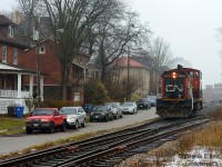 Caption: Kevin's recent shot of L566 parked on the Waterloo spur, had consequences for the rest of the Guelph sub as now the Kitchener terminal would be quite short of motive power. To ensure two jobs operated the GMTX units (2) were assigned to 568 and L540 took this as their sole motive power to putter around between Kitchener, Guelph, Acton, and back. Returning from Canwel in Acton light power I took the opportunity to photograph 1444 passing Guelph's famous beside-street running at Kent St. In the far background are some of Guelph's landmarks - the Armoury an active yet historic 1906 DND facility and the new River House condos. A GMD1 on the Guelph sub in 2018? Pinch me.