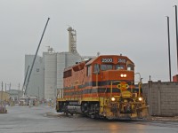 <b>Goodbye, farewell and thank god P&H is finally receiving cars.</b> The final (for now at least) railway/region in Ontario's southern shortline exodus is SORs Hamilton based operation. Today, the last day, I was fortunate enough to get some of their last movements to the various industries. Parrish and Heimbecker, a Canadian agricultural company with over a century in operation, announced in 2014 that they would be adding to  their sprawling, national network with a new mill to be built in the Hamilton port. Within the last few weeks, after about 2 years of the mill being in operation they are finally receiving product in railcars (in addition to trucks), just in time for SOR to get used to switching them... Based on the brief history thus far the mill is busy with seemingly daily (week day) switching, spotting about a dozen loads on property every trip. It'll be sad for me without the existence of SOR in Hamilton. It's been like that for as long as I can remember, all the way back to the SW1200s and the <a href="http://www.railpictures.ca/?attachment_id=21772">blue B-unit</a>. Can't even count the number of times my dad, brother and I would wonder around the outside of the shop looking at whatever power was parked there. Now the shop, most of that power and the railway are gone altogether. This makes me appreciate the bit of SOR that remains south of Garnet, so all is not lost and the Orange will still be available in southern Ontario. I'd also like to thank <a href="http://railpictures.ca/author/jknott86">Jaime Knott</a> for some of the above and "on-scene" informing and helping me catch this movement, I wouldn't have got this shot otherwise. 